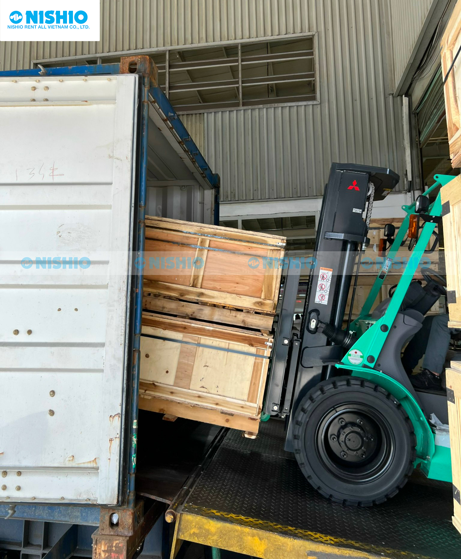 NISHIO Forklift loading goods into a container.