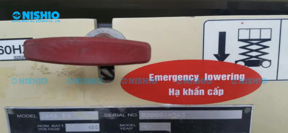 Image of the Emergency Lowering Button on a JLG Scissor Lift